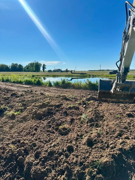 Excavation beside a pond